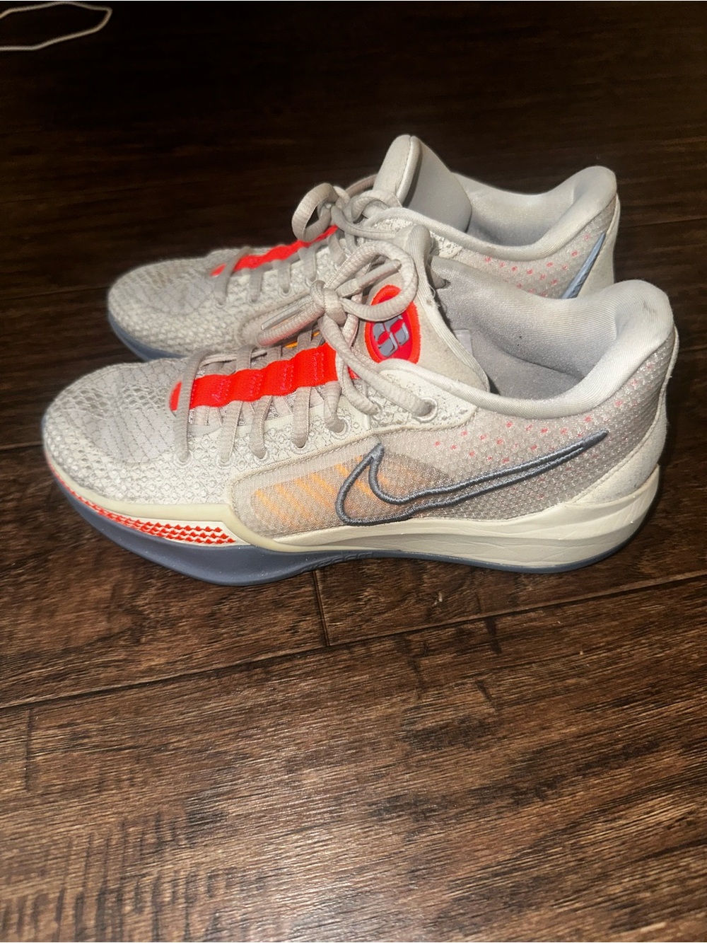 Nike Women's Light Gray Athletic Sneakers with Orange Accents